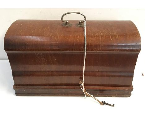 A vintage Vest sewing machine in wooden case, with instructions and accessories, serial number 16234/0 