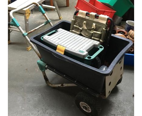 A garden wheelbarrow with two wheels and removable plastic tub, together with a plastic toolbox on wheels 