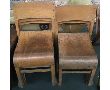 A set of five vintage wooden school chairs 