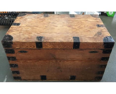A large pine and metal bound trunk 