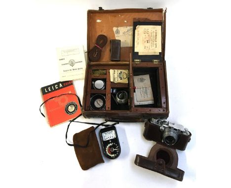 A Leica 111f 1952/3, No.361437, with Summar 50mm 1:2 lens lens No.387984, in hard leather case with accessories to include a 