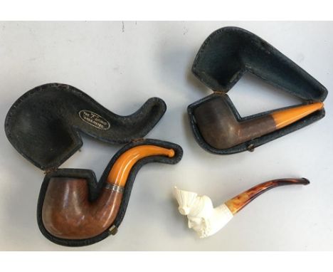 A Meerschaum pipe of a turbaned gentleman, together with two other cased pipes 