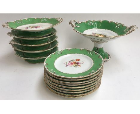 A Coalport part tea service, in green highlighted in gilt with central flower design and pierced rim, numbered to base 2/7971