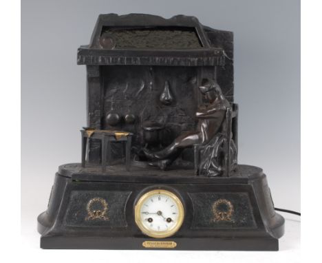 A circa 1900 French cast bronzed metal illuminated mantel clock, the white enamel dial with Roman numerals and twin winding h