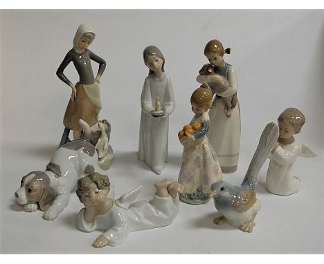 Assorted Lladro china ornaments, to include girl with lamb, girl with night-light, praying child, bird, puppy etc (8)