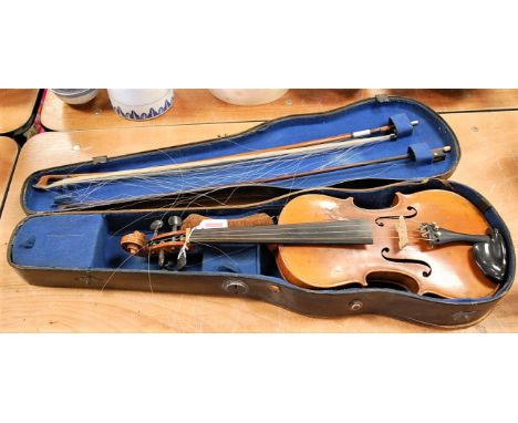 A continental violin having ebony finger board and two piece maple back, bearing a label for Anthonio Stradivarius, Cremonen,