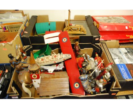 Two boxes of various medieval figures, wooden gypsy caravan, and a model of a guillotine