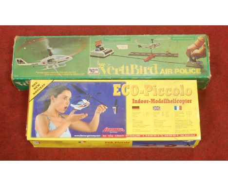 An Ikarus Eco-Piccolo indoor model helicopter, boxed; together with a boxed Burbank Toys battery operated Vertibird Air Polic