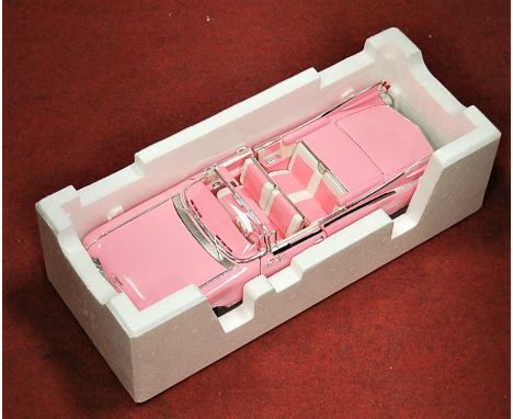 A boxed Maisto 1:12 scale model of a Cadillac Eldorado Biarritz (1959), in pink