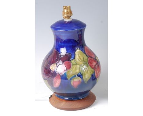 A Moorcroft pottery table lamp in the Anemone pattern, underglazed and tube-line decorated, of lower baluster form, raised on