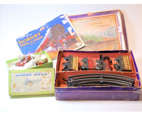 A boxed Hornby clockwork train 'Mo' passenger set; together with "The Hornby Book of Trains 1934-5", a Dealer USA mid 20th ce