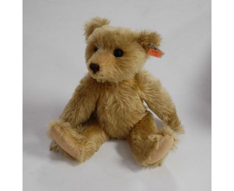A modern Steiff mohair collector's bear having button to the ear and white label No. 406096, further numbered verso 00922