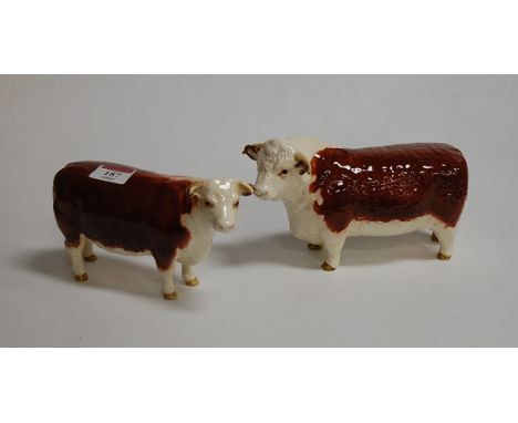 A Beswick model of Highland bull Champion of Champions, gloss finish; and one other by the factory (2)