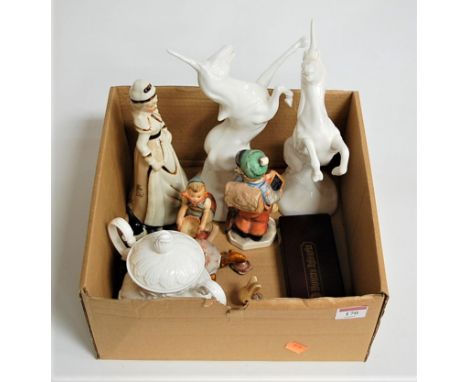 A pair of Michael Sutty porcelain figures of rearing unicorns, together with a Hummel figure of a girl, one other West German