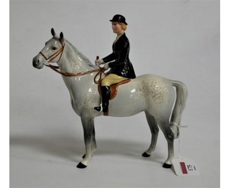 A Beswick model of a huntswoman on dapple grey horse model No. 1730, height 22cm