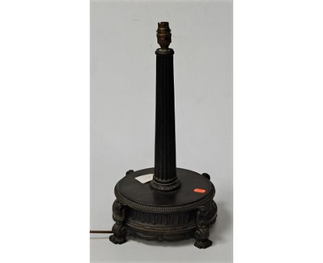 A spelter table lamp base having a fluted column to a circular base with scrolled feet, height 48cm including fittings