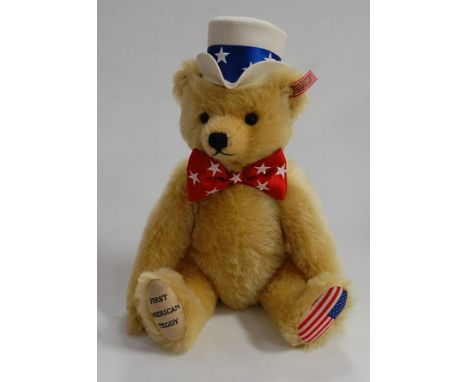 A modern Steiff First American teddy Steiff North American exclusive bear, with button to ear and red &amp; white striped lab