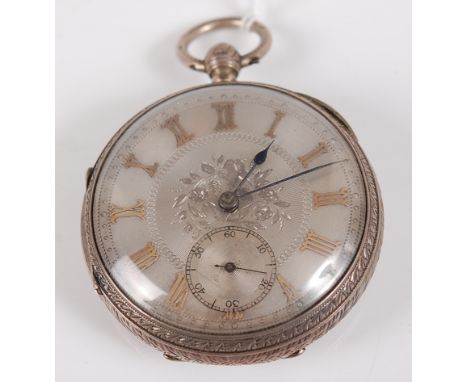 A late Victorian Gents silver cased open faced gent's pocket watch, having an engine turned silvered dial with yellow metal r
