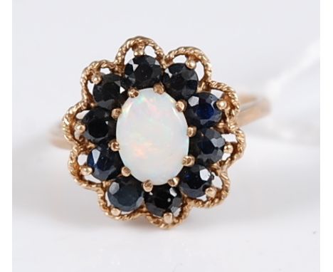 A 9ct gold, opal and sapphire set flower head dress ring, 3.5g, size M