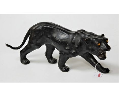 A 20th century leather clad model of a puma in stalking pose, length 41cm