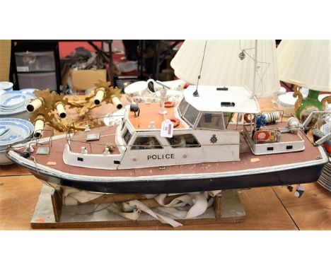 A scratch built model of a Police cruiser with various figures and accessories, length 105cm
