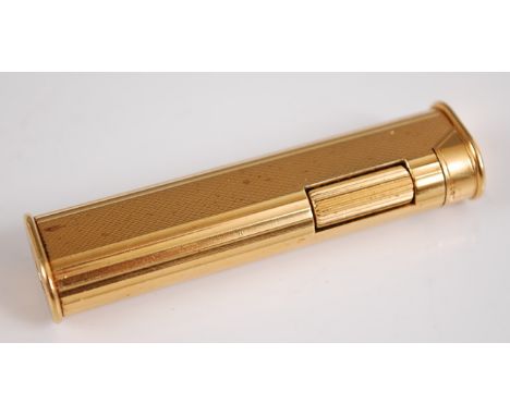 A Dunhill gilt brass and engine turned gent's pocket lighter, in associated leather case