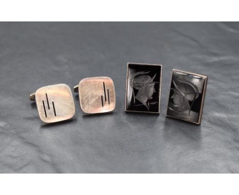 A pair of Danish silver cufflinks, the square panels having enamel line decoration on solid bar attachments, along with a pai