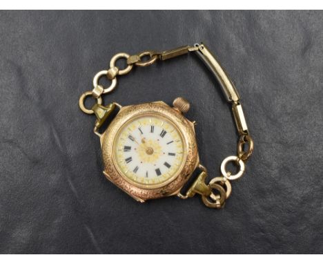 A 14ct gold top wound modified pocket watch, the white dial having Roman numerals with gold tone decoration, the reverse havi