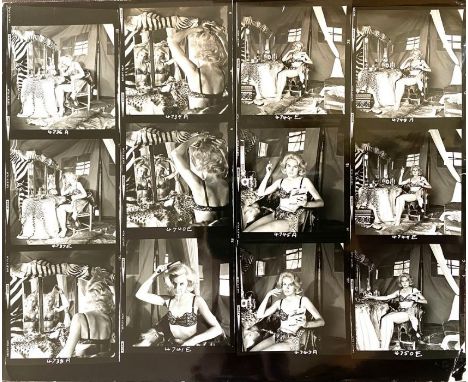 Collection of approximately 140 black & white movie stills and contact sheets, many bearing stamps & captions verso, to inclu