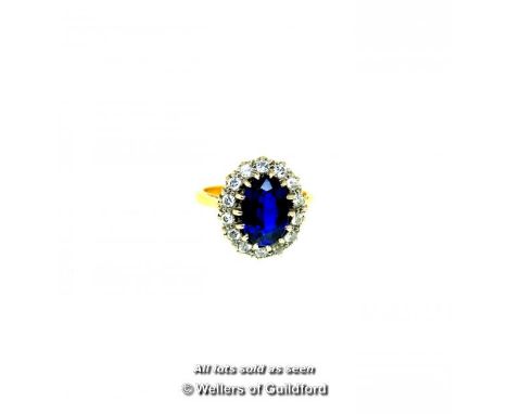 Vintage synthetic sapphire and diamond cluster ring, oval cut synthetic sapphire weighing an estimated 2.80cts, with a surrou