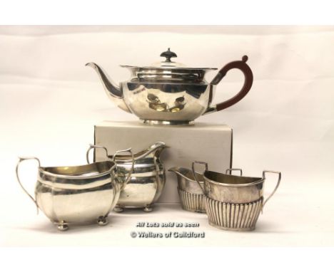 An Edwardian silver teapot with ebonised knop, London 1912; fluted silver cream jug and sugar, Birmingham 1918; silver sugar,