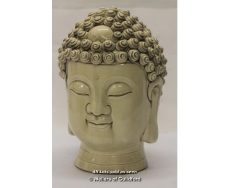 A Chinese blanc-de-chine portrait bust of of buddha, 26cm.
