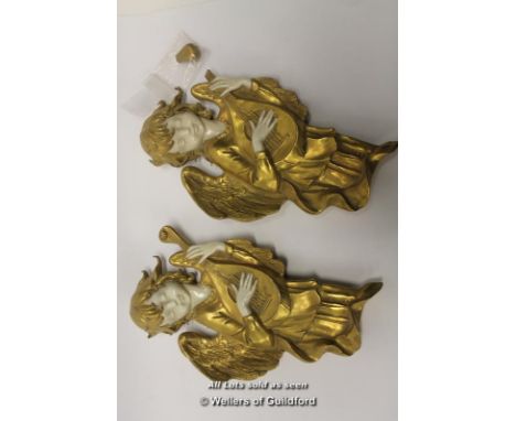 A pair of Naples wall ornaments of lute playing angels, 22cm.