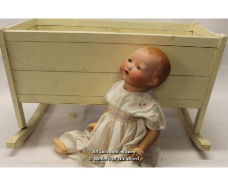 An Armand Marseille bisque head doll with sleeping blue eyes and open mouth, stamped AM Germany 351/8.K; painted wooden doll'