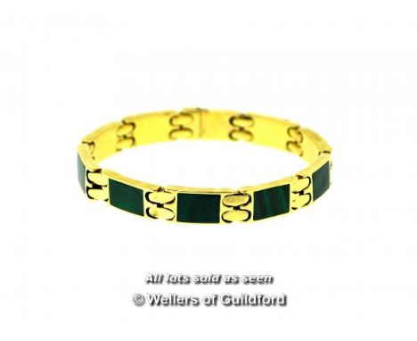 Malachite panel bracelet, nine panels set with malachite in yellow metal tested as 18ct, with Egyptian mark for 18ct, length 
