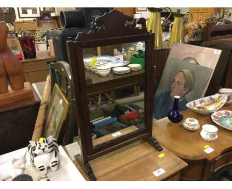 A mahogany framed swing mirror