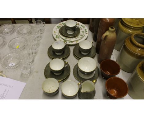A quantity of Wedgwood bone china teacups and saucers;and three Wedgwood "Wild Strawberry" plates 