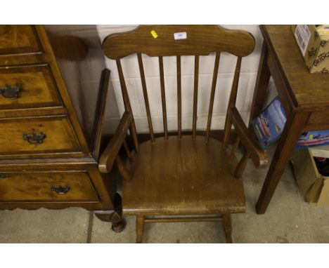 A child's stick back rocking chair 