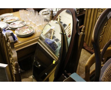 An unframed and bevel edged mirror; together with one other mirror 