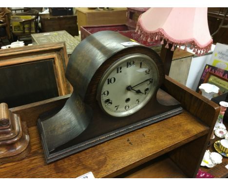A 1920's / 30's oak cased three hole mantel clock 