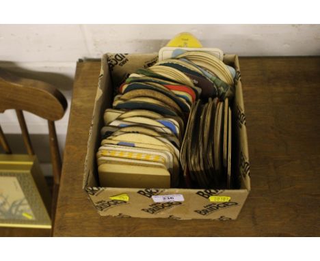 A box of vintage beer mats 