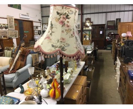 A mahogany standard lamp and shade