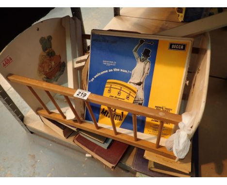 Dolls swinging cot with quantity of vintage books and records