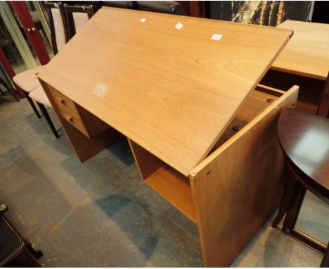 Pine drawing desk with tilt top two lower drawers and storage shelf