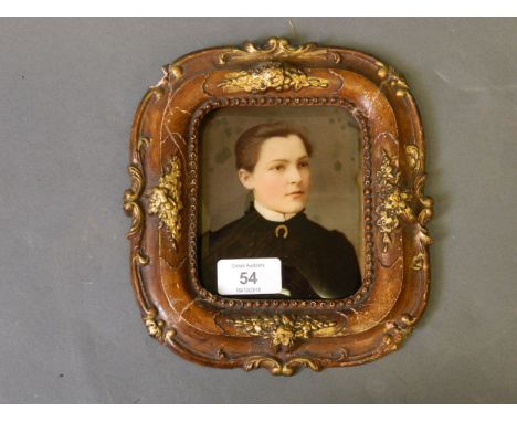 A C19th ambrotype portrait of a young woman in a shaped gilt frame, 8'' x 7'' overall 