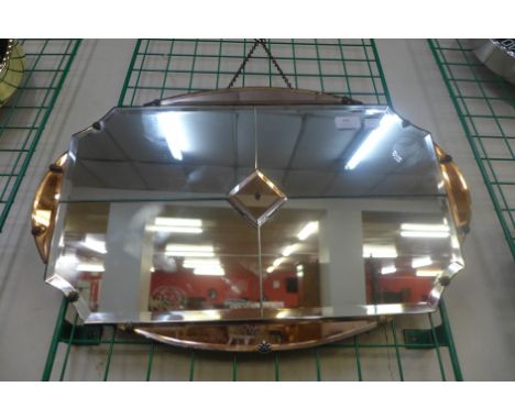 An Art Deco peach bevelled mirror 