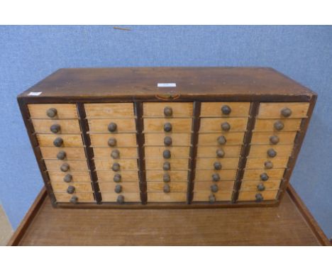 A vintage beech table top chest 