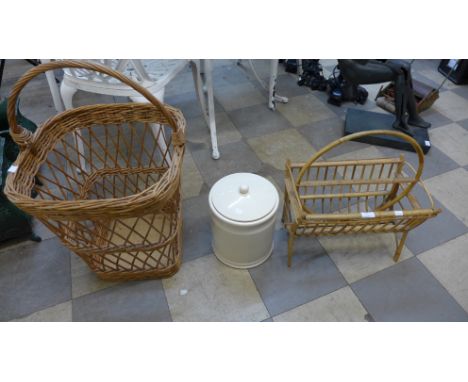 A wicker log basket, magazine rack and a ceramic bread bin 