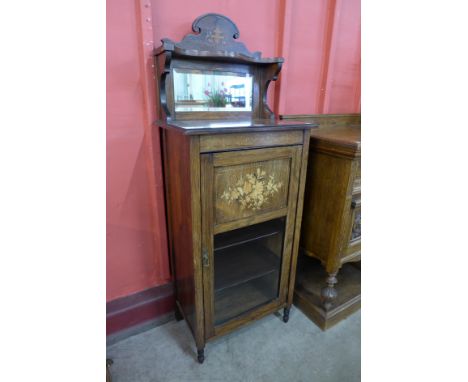 An Edward VII rosewood and marquetry inlaid music cabinet 