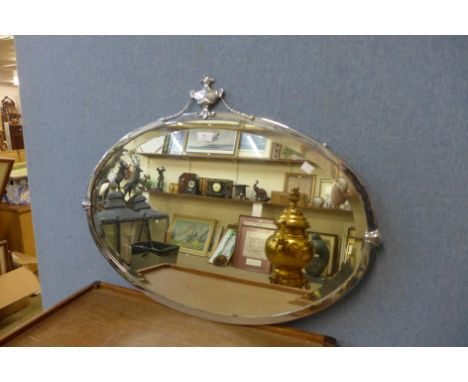 An Art Deco steel framed oval mirror 